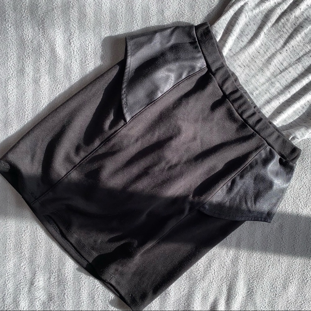 Black mini skirt with leather peplum sides